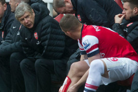 Lukas Podolski talks to Arsène Wenger